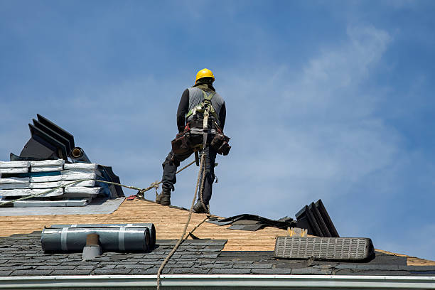 Professional Storm Damage Roof Repair technician working in Amherst, OH